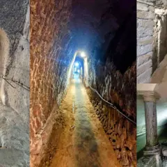 Sotterranei del borgo medievale di Orte: scale scavate nella roccia, cunicoli illuminati e nicchie antiche.